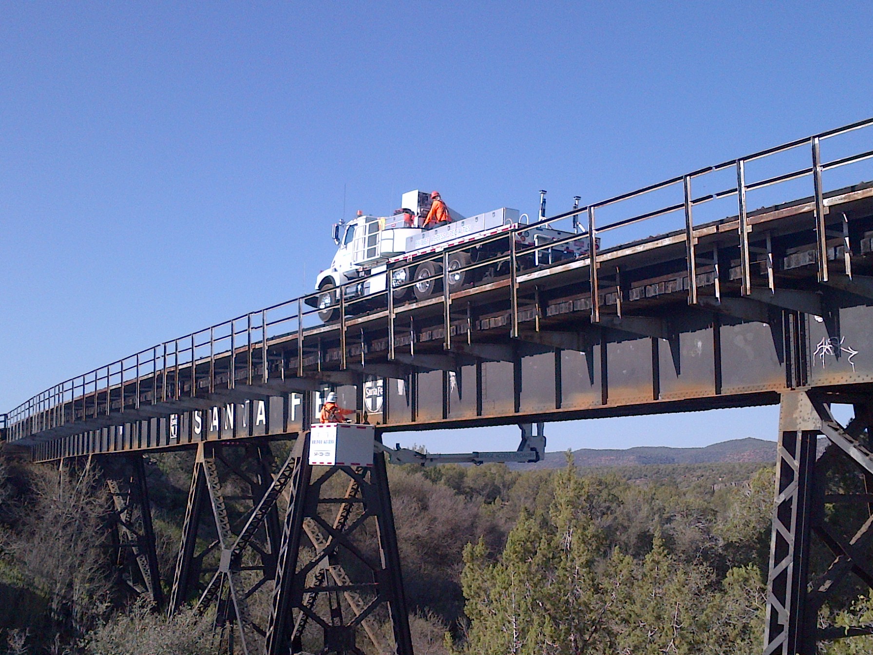 Highway bridge inspection, Under bridge maintenance, Railroad Snooper inspection truck.