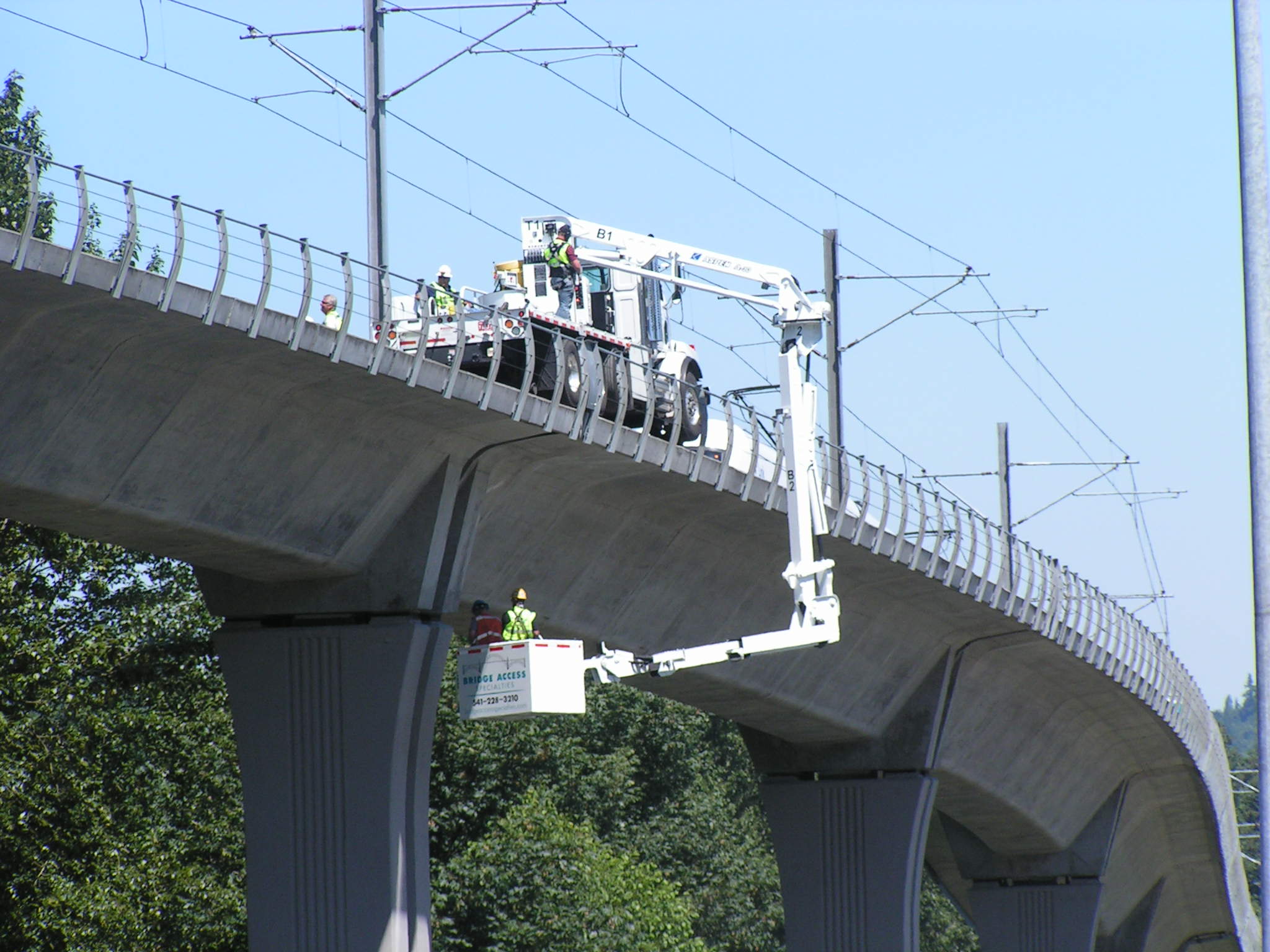 Highway bridge inspection, Under bridge maintenance, Railroad Snooper inspection truck.