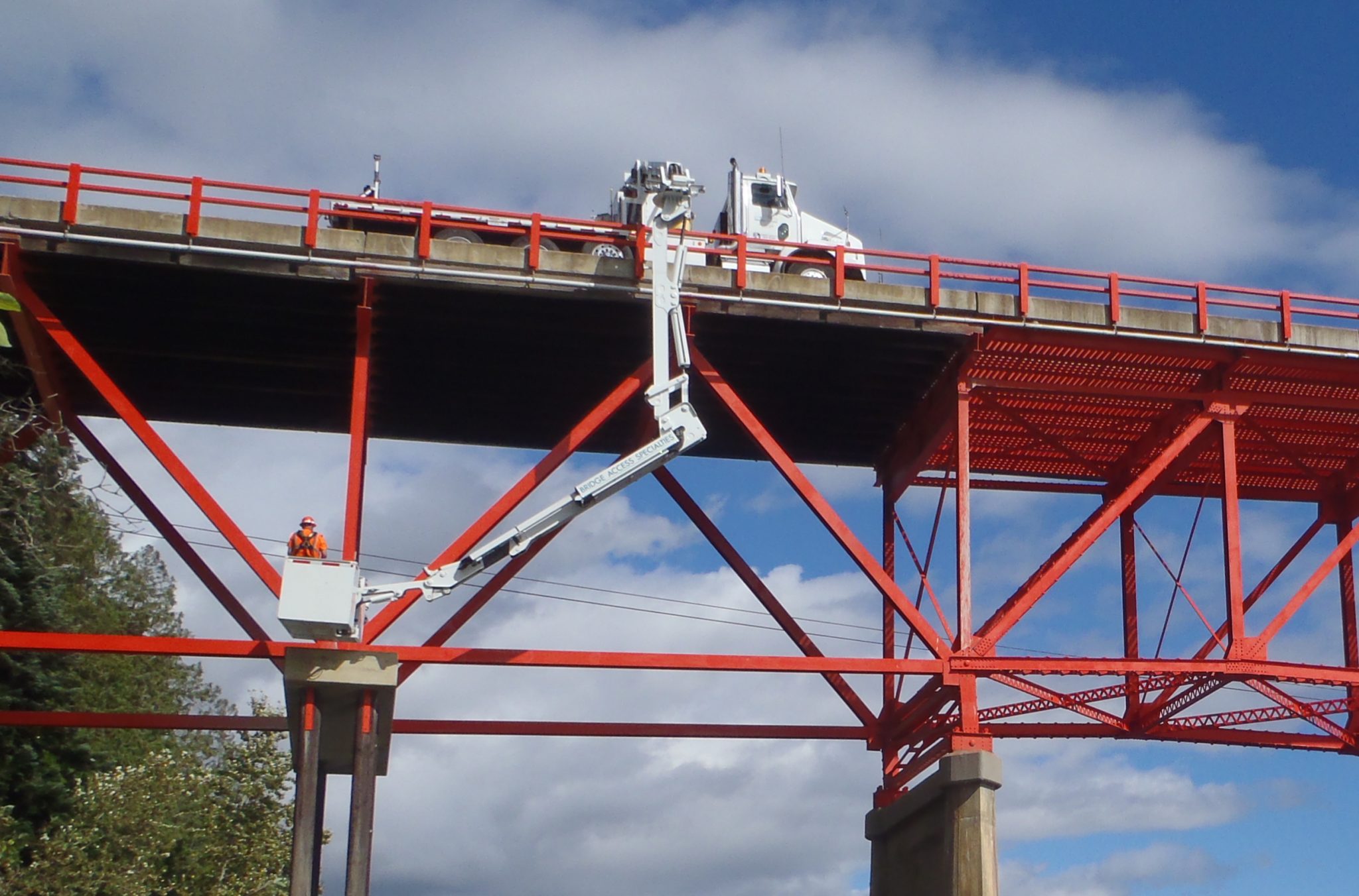 Highway bridge inspection, Under bridge maintenance, Railroad Snooper inspection truck.
